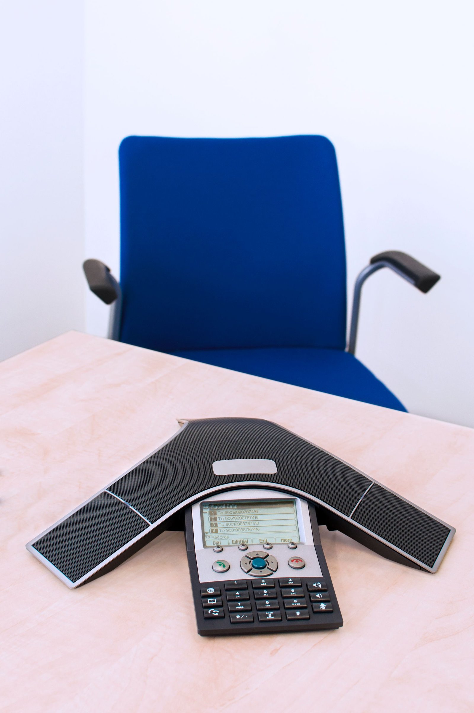 An IP desk phone on an office desk
