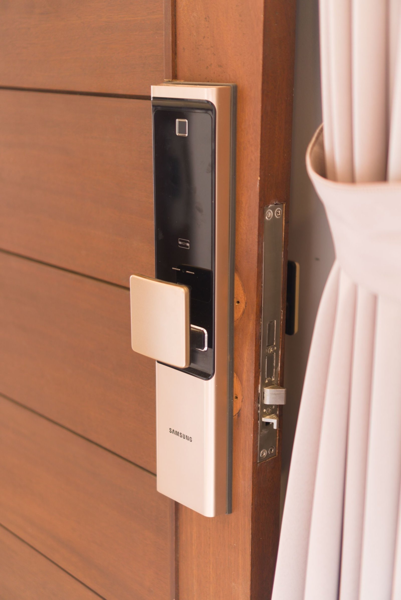 An electronic card lock fitted to a wooden door