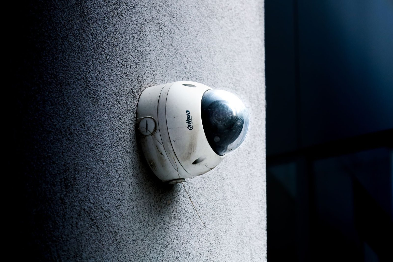 Dome CCTV camera on a concrete wall
