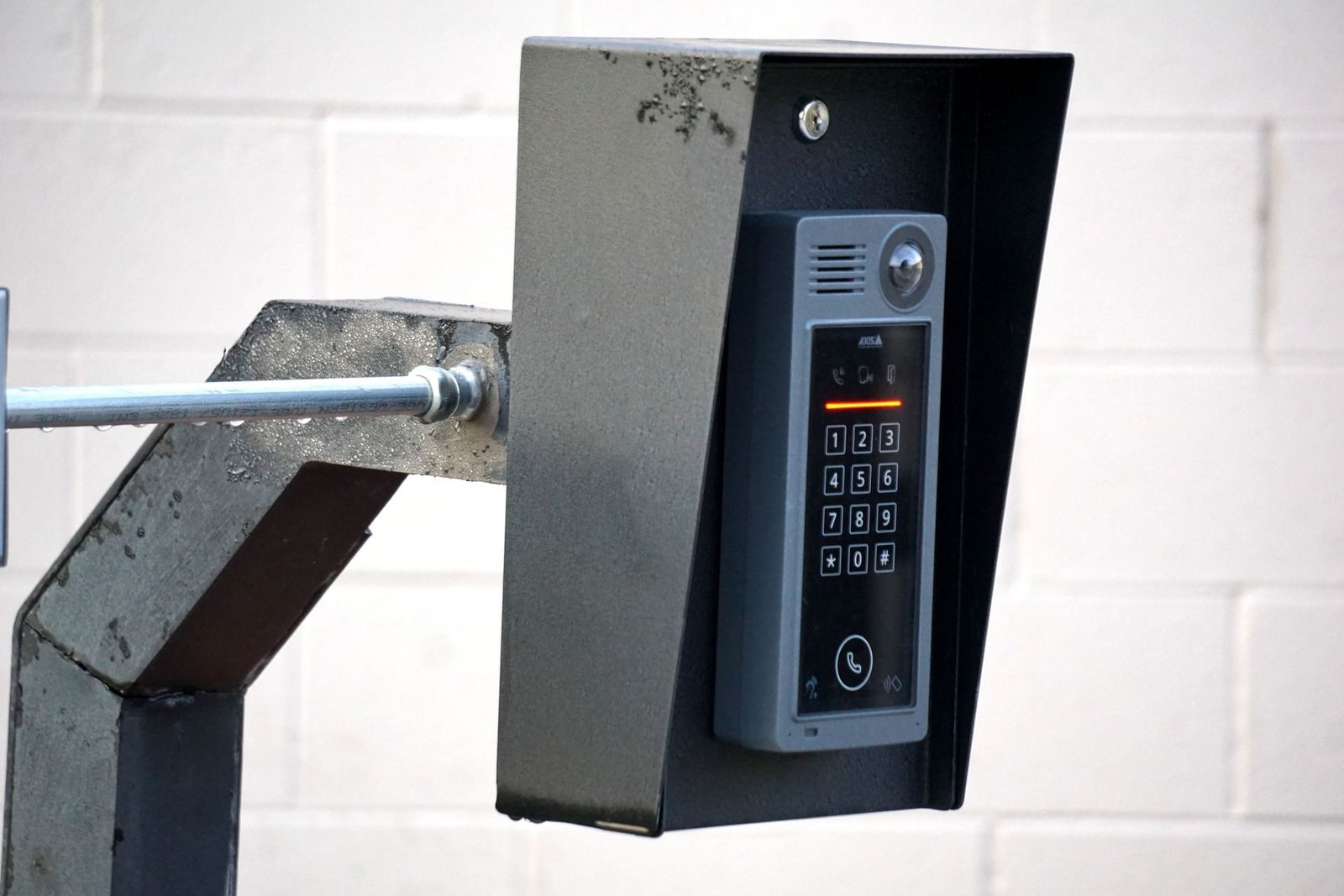Security intercom with keypad mounted on a wall