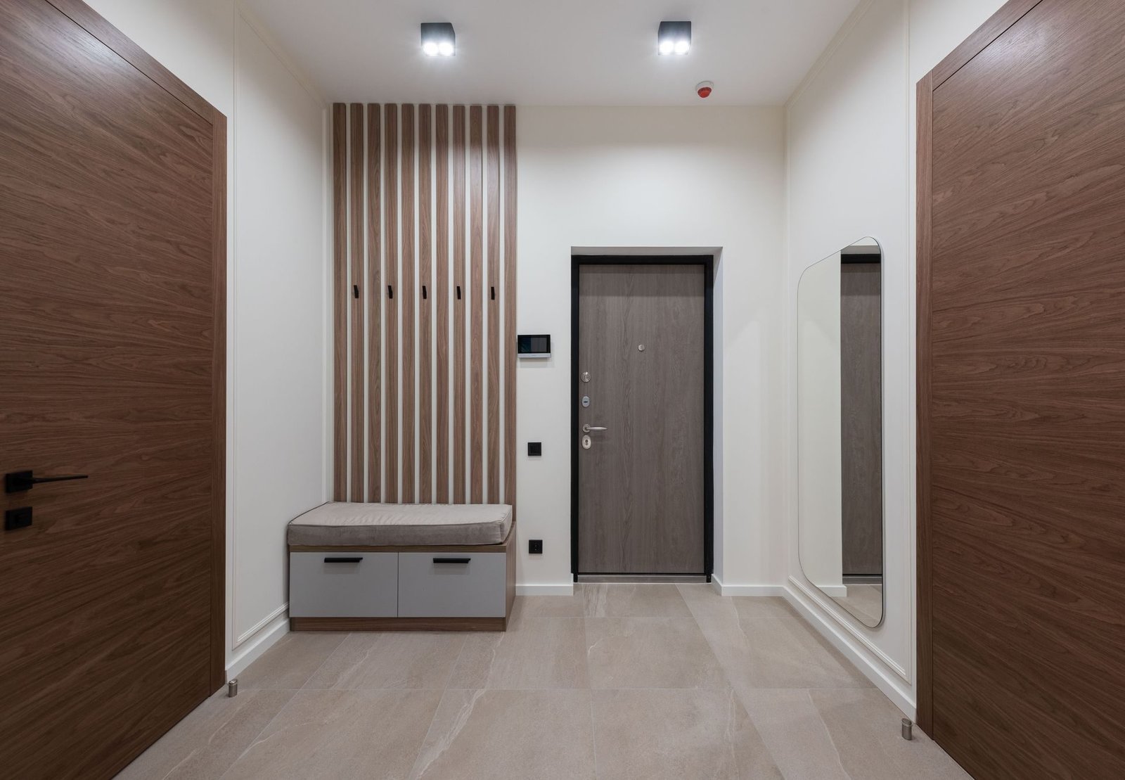 A modern building lobby with a closed entrance door