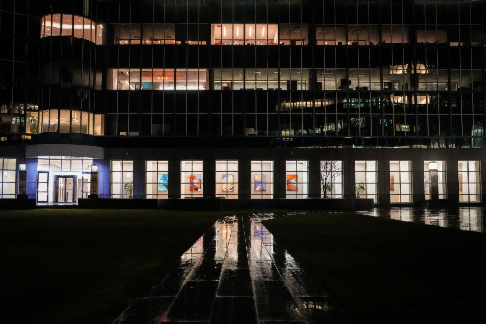 An office building with lit windows at night
