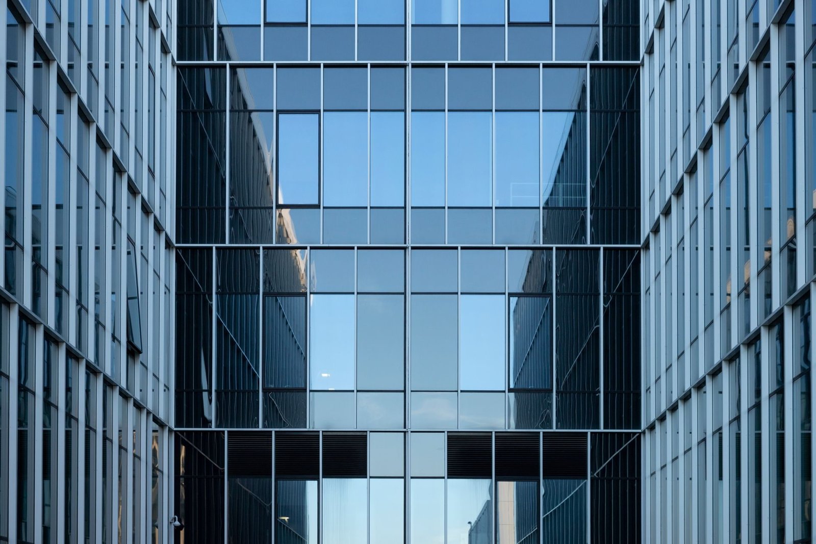 A glass office building seen from below