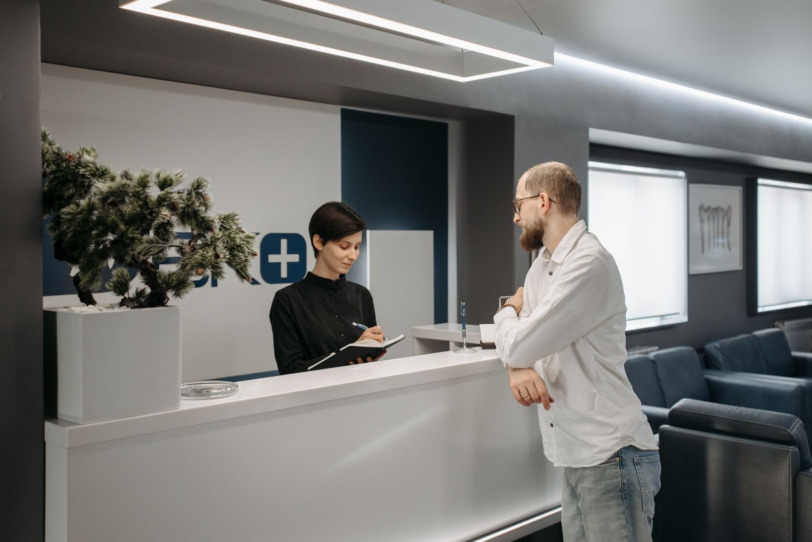A reception desk in an office lobby