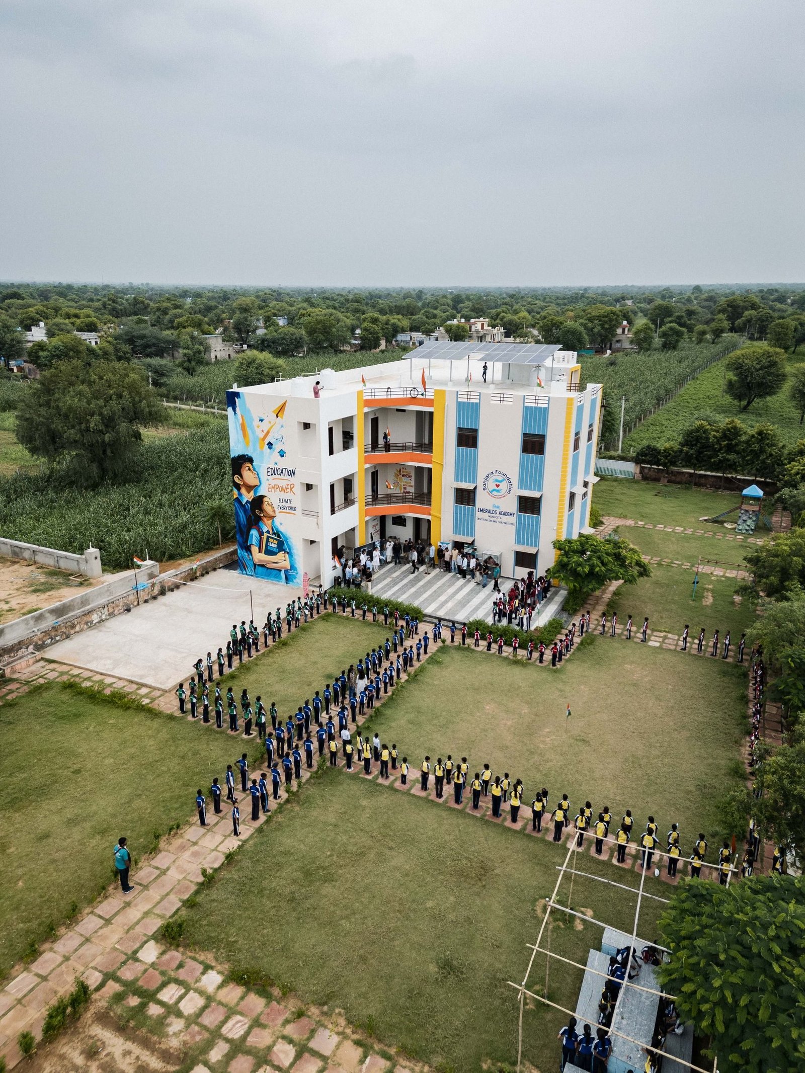 A colourful school building with a playground